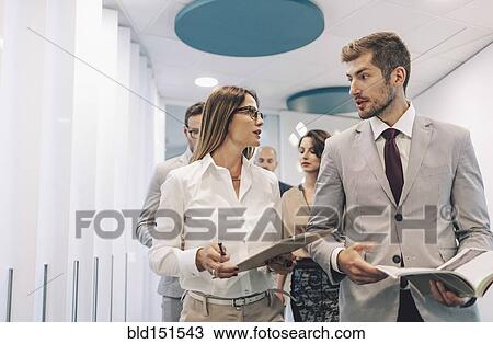Caucasian business people talking in office View Large Photo Image Stock Image - Caucasian business people talking in office. Fotosearch