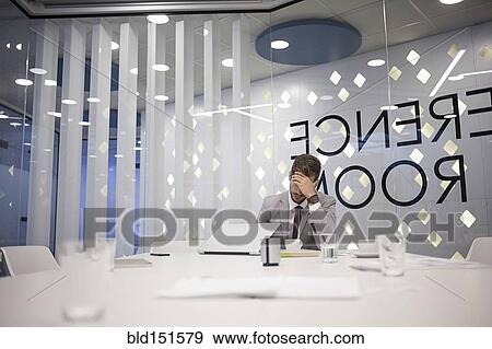 Caucasian businessman working in conference room View Large Photo Image Stock Photo - Caucasian businessman working in conference room. Fotosearch