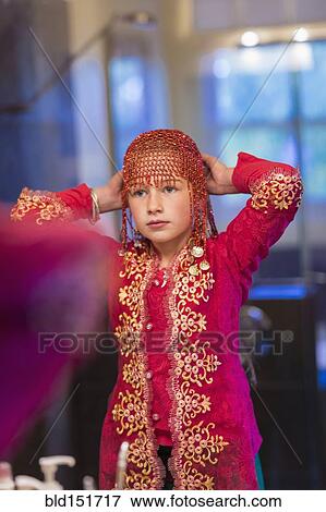 Stock Photo - Caucasian girl wearing beaded cap. Fotosearch