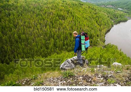 Caucasian hiker in rocky remote landscape View Large Photo Image Stock Image - Caucasian hiker in rocky remote landscape. Fotosearch