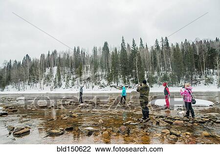 Caucasian hikers walking in rocky remote river View Large Photo Image Stock Image - Caucasian hikers walking in rocky remote river. Fotosearch