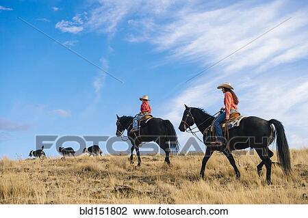 Caucasian mother and son on horseback on grassy hill View Large Photo Image Stock Image - Caucasian mother and son on horseback on grassy hill. Fotosearch