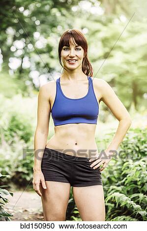 Caucasian runner standing in park View Large Photo Image Stock Image - Caucasian runner standing in park. Fotosearch
