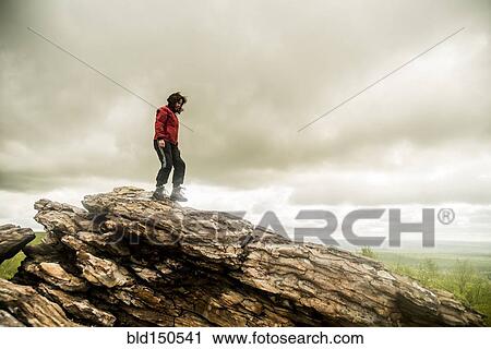 Caucasian woman climbing rock formation View Large Photo Image Stock Image - Caucasian woman climbing rock formation. Fotosearch