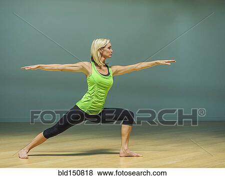 Caucasian woman practicing yoga in studio View Large Photo Image Stock Photo - Caucasian woman practicing yoga in studio. Fotosearch