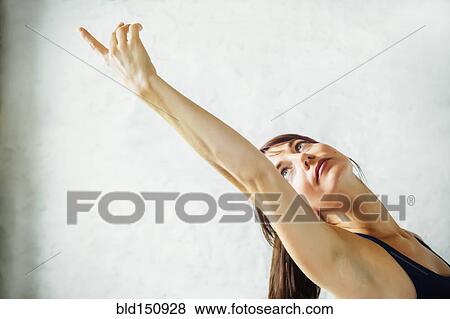 Stock Photo - Caucasian woman practicing yoga. Fotosearch
