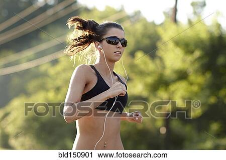 Caucasian woman running outdoors View Large Photo Image Stock Image - Caucasian woman running outdoors. Fotosearch