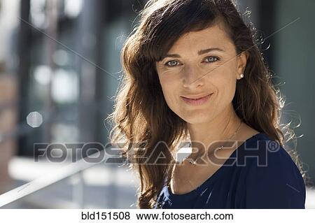 Caucasian woman smiling outdoors View Large Photo Image Stock Photo - Caucasian woman smiling outdoors. Fotosearch