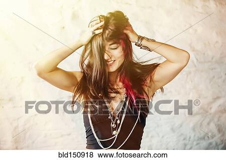 Stock Photo - Caucasian woman tossing her hair. Fotosearch