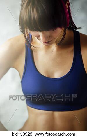Caucasian woman wearing sports bra View Large Photo Image Stock Image - Caucasian woman wearing sports bra. Fotosearch