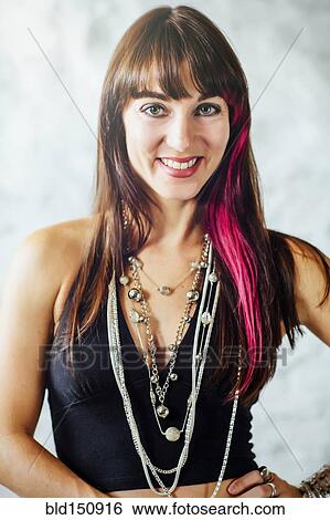 Caucasian woman with dyed hair smiling View Large Photo Image Stock Photograph - Caucasian woman with dyed hair smiling. Fotosearch