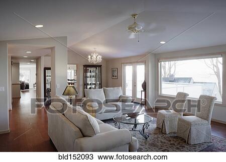 Stock Image - "Chairs, sofas and coffee table in living room". Fotosearch