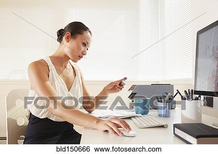 Chinese businesswoman shopping online with credit card View Large Photo Image Stock Photograph - Chinese businesswoman shopping online with credit card. Fotosearch