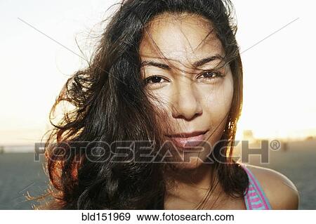 Close up of face of serious Hispanic woman View Large Photo Image Stock Photo - Close up of face of serious Hispanic woman. Fotosearch