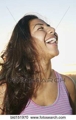 Close up of Hispanic woman laughing View Large Photo Image Stock Image - Close up of Hispanic woman laughing. Fotosearch