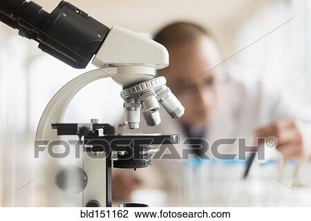 Stock Image - Close up of microscope in laboratory. Fotosearch