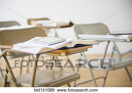 Digital tablet and book on desk in classroom View Large Photo Image Stock Photo - Digital tablet and book on desk in classroom. Fotosearch