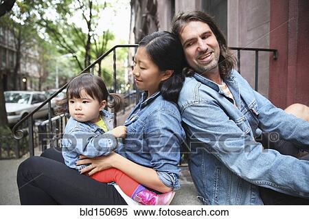 Family sitting on front stoop in city View Large Photo Image Stock Photography - Family sitting on front stoop in city. Fotosearch