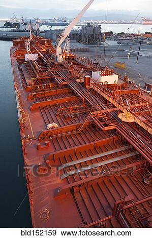 Stock Photo - High angle view of deck piping on oil tanker ship. Fotosearch