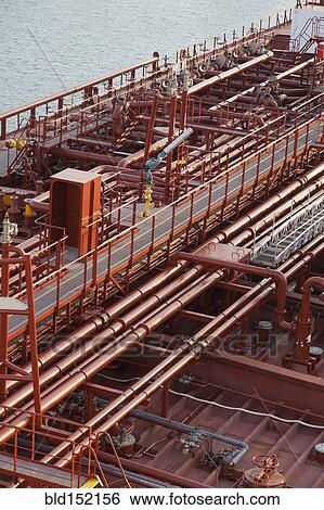 Stock Photograph - High angle view of deck piping on oil tanker ship. Fotosearch