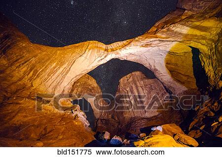 "Illuminated rocks at night in Arches National Park, Moab, Utah, United States" View Large Photo Image Stock Photography - "Illuminated rocks at night in Arches National Park, Moab, Utah, United States". Fotosearch