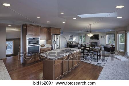 Stock Photo - Island in open kitchen and dining room. Fotosearch