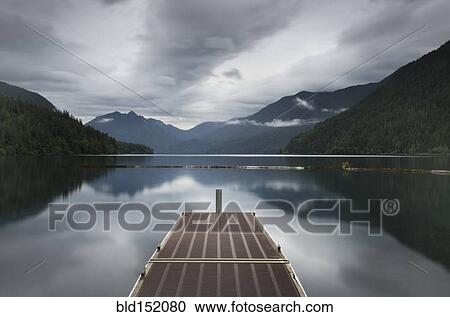 Metal pier over still remote lake View Large Photo Image Stock Image - Metal pier over still remote lake. Fotosearch
