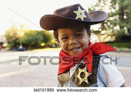 Mixed race boy in cowboy costume smiling outdoors View Large Photo Image Stock Photography - Mixed race boy in cowboy costume smiling outdoors. Fotosearch