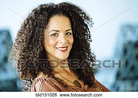 Mixed race businesswoman smiling View Large Photo Image Stock Photograph - Mixed race businesswoman smiling. Fotosearch