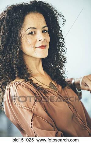 Mixed race businesswoman smiling View Large Photo Image Stock Photography - Mixed race businesswoman smiling. Fotosearch
