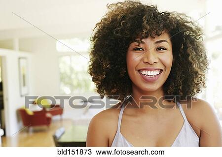 Stock Image - Mixed race woman smiling. Fotosearch