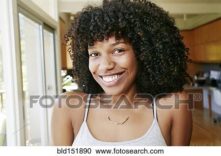 Mixed race woman smiling View Large Photo Image Stock Image - Mixed race woman smiling. Fotosearch