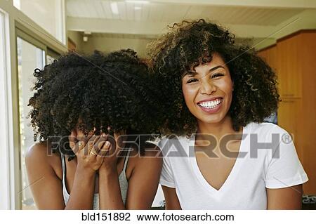 Mixed race women laughing View Large Photo Image Stock Image - Mixed race women laughing. Fotosearch