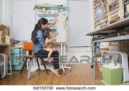 Mother and daughter admiring dress form in sewing room View Large Photo Image Stock Image - Mother and daughter admiring dress form in sewing room. Fotosearch