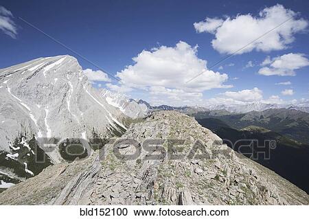 Mountain peak overlooking remote landscape View Large Photo Image Stock Image - Mountain peak overlooking remote landscape. Fotosearch
