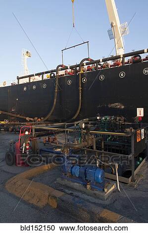 Oil tanker ship docked in industrial harbor View Large Photo Image Stock Image - Oil tanker ship docked in industrial harbor. Fotosearch