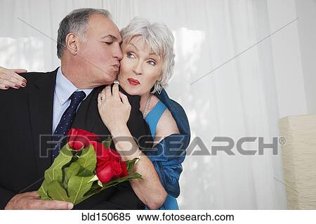 Older couple in formal wear kissing View Large Photo Image Stock Photography - Older couple in formal wear kissing. Fotosearch