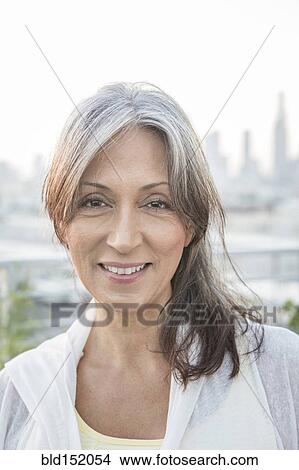Older mixed race woman smiling View Large Photo Image Picture - Older mixed race woman smiling. Fotosearch