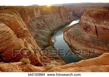 "River winding through majestic rock formations in desert landscape, Page, Arizona, United States" View Large Photo Image Picture - "River winding through majestic rock formations in desert landscape, Page, Arizona, United States". Fotosearch