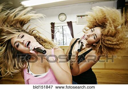 Singers rehearsing in studio View Large Photo Image Stock Photo - Singers rehearsing in studio. Fotosearch