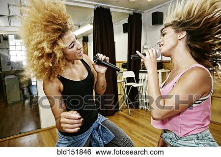Singers rehearsing in studio View Large Photo Image Stock Photograph - Singers rehearsing in studio. Fotosearch