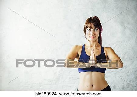 Picture - Smiling Caucasian woman meditating. Fotosearch