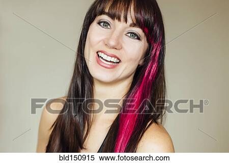 Smiling Caucasian woman with pink dye in hair View Large Photo Image Stock Photography - Smiling Caucasian woman with pink dye in hair. Fotosearch