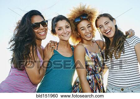 Smiling women posing outdoors View Large Photo Image Stock Image - Smiling women posing outdoors. Fotosearch