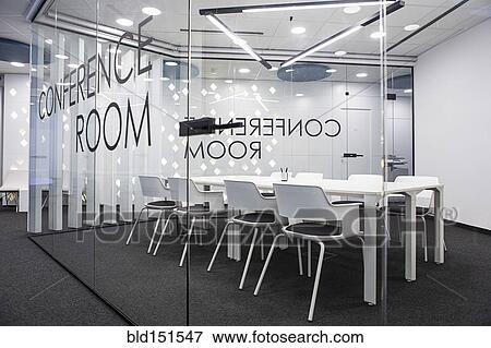 Stock Photo - Table and chairs in empty office conference room. Fotosearch