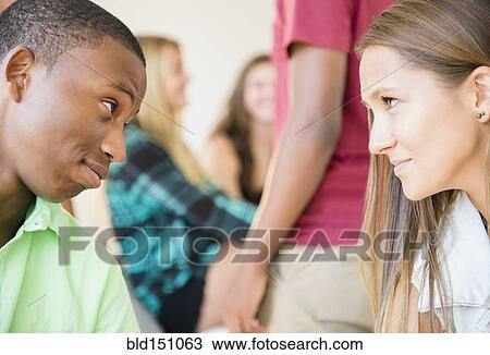 Teenagers face to face at party View Large Photo Image Stock Image - Teenagers face to face at party. Fotosearch