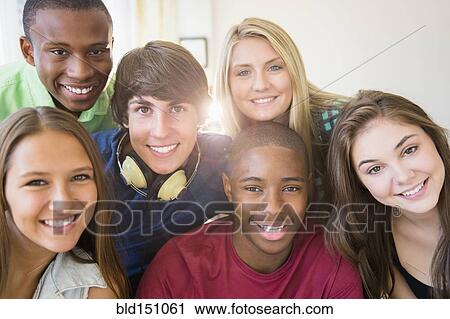 Stock Image - Teenagers smiling together. Fotosearch