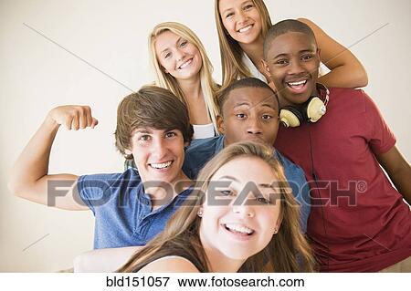 Stock Photo - Teenagers smiling together. Fotosearch