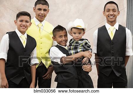 Boys in Hispanic family celebrating quinceanera View Large Photo Image Stock Photograph - Boys in Hispanic family celebrating quinceanera. Fotosearch