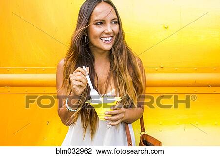 Caucasian woman eating shaved ice View Large Photo Image Stock Image - Caucasian woman eating shaved ice. Fotosearch